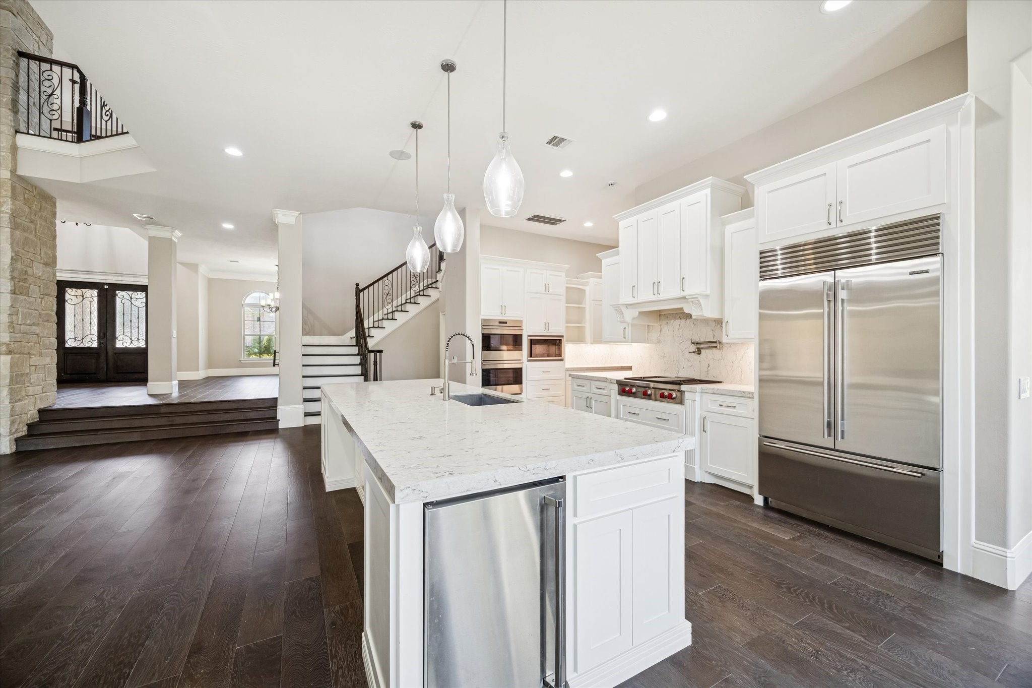 21018 Kings River Point Kingwood, TX 77346 - Photo 18 of 50 a kitchen with a sink a counter top space and stainless steel appliances