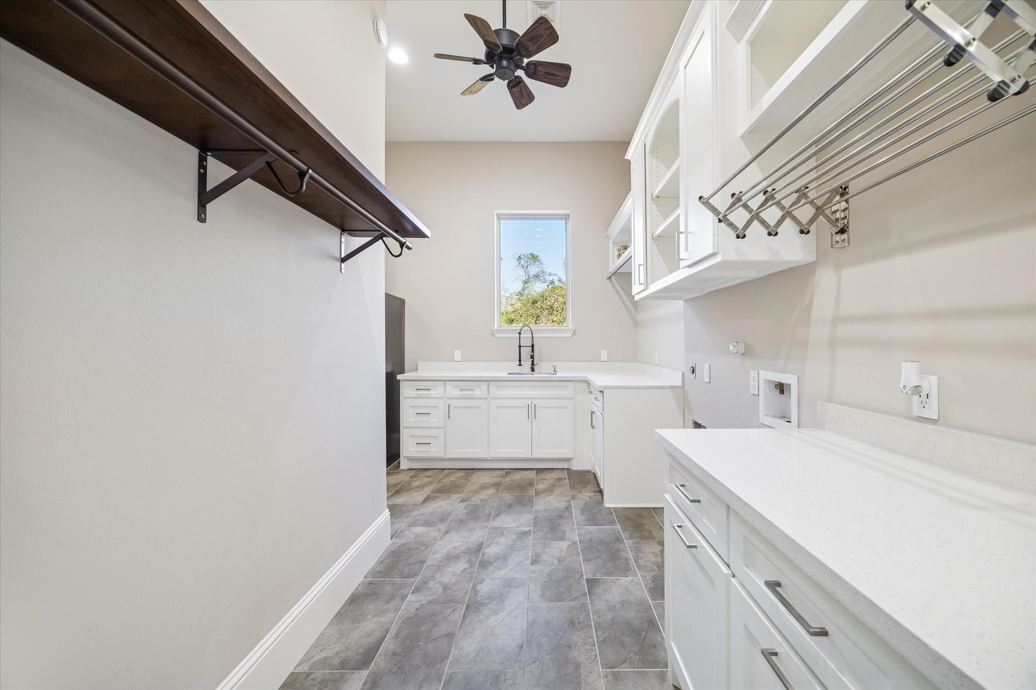 21018 Kings River Point Kingwood, TX 77346 - Photo 24 of 50 a kitchen with a sink cabinets and window