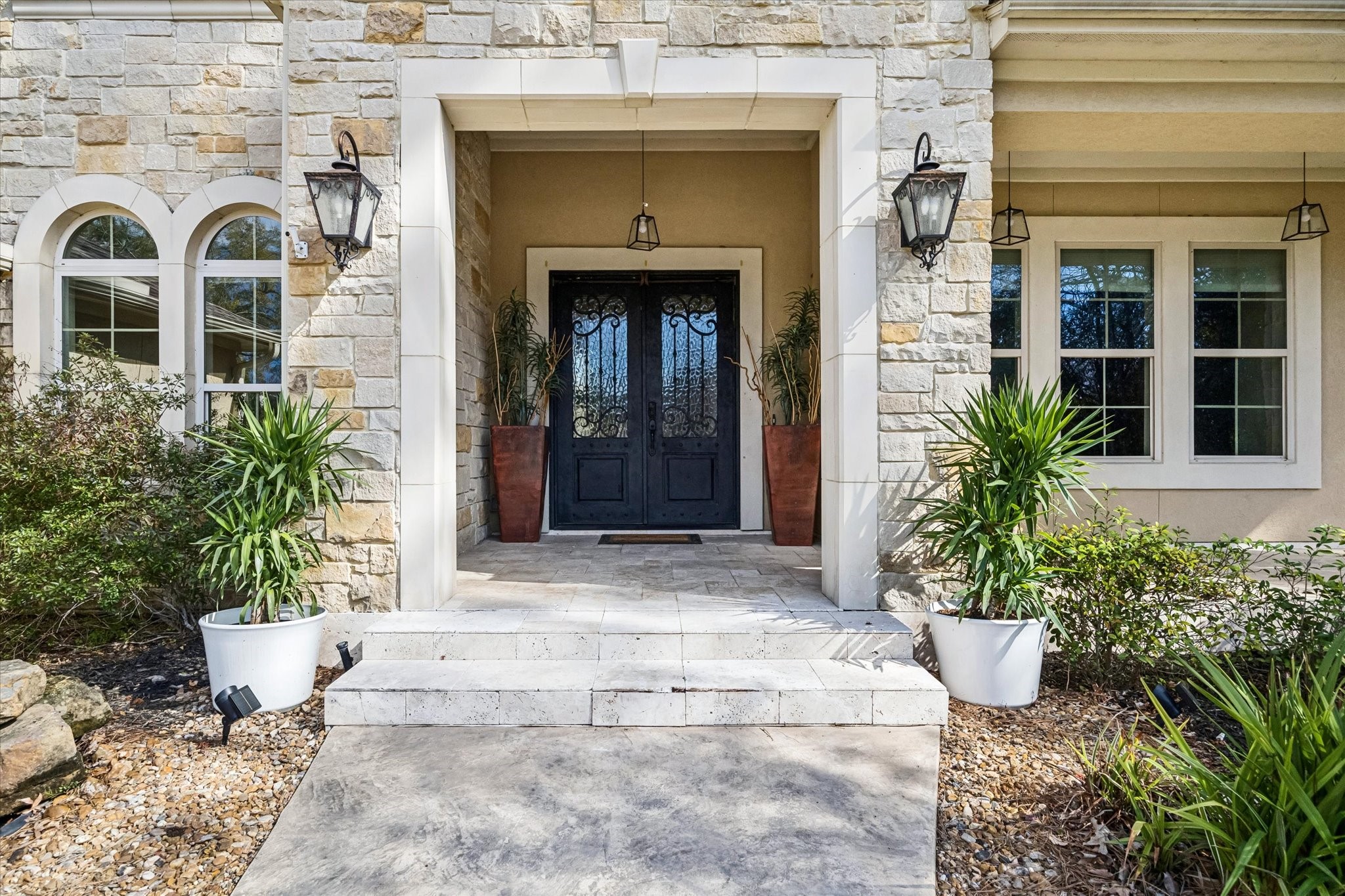 21018 Kings River Point Kingwood, TX 77346 - Photo 3 of 50 a front view of a house with potted plants