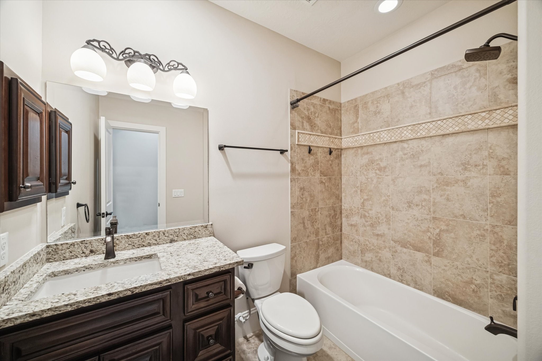 21018 Kings River Point Kingwood, TX 77346 - Photo 42 of 50 a bathroom with a granite countertop sink toilet and shower
