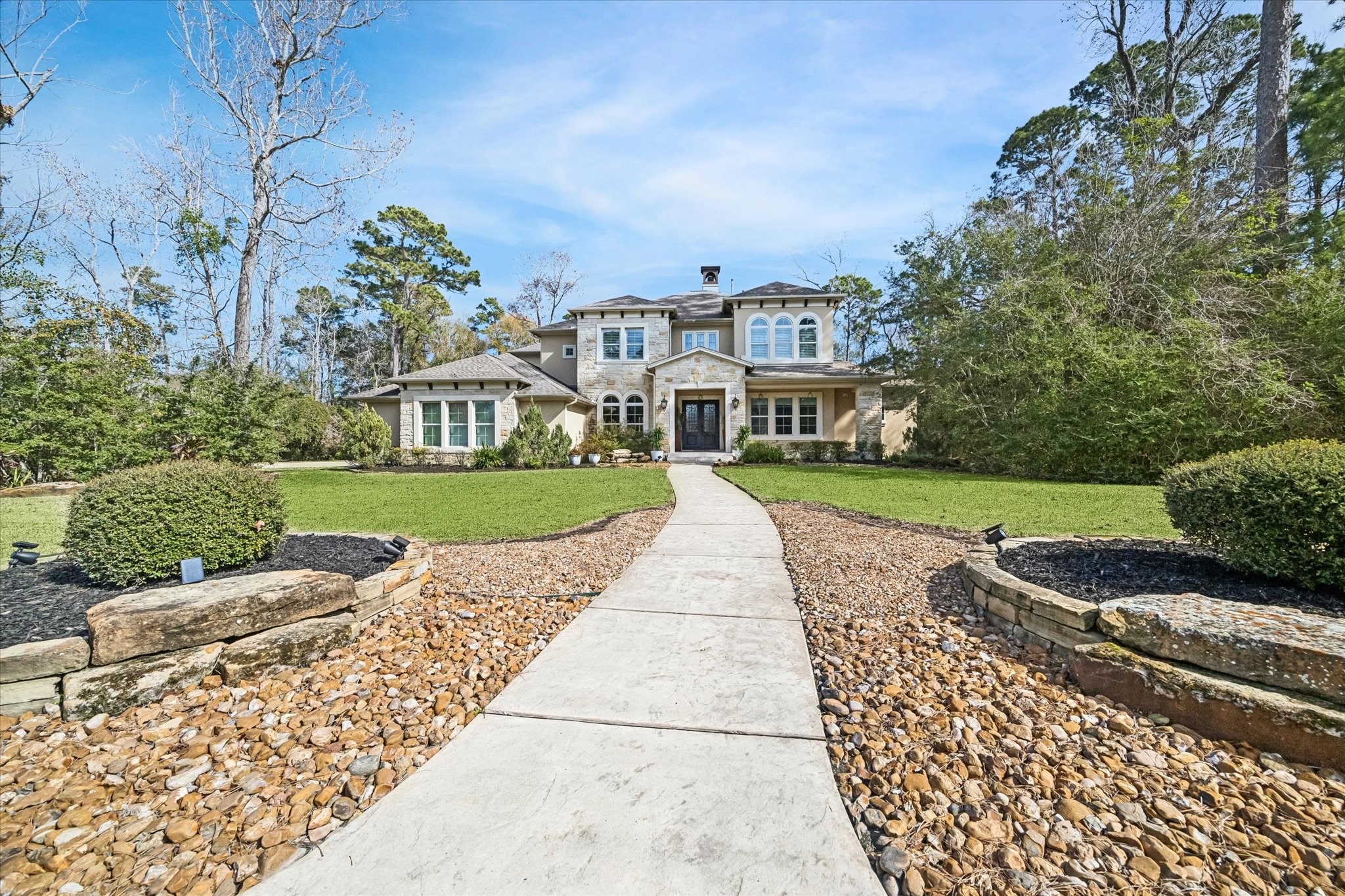 21018 Kings River Point Kingwood, TX 77346 - Photo 47 of 50 front view of a house with a yard