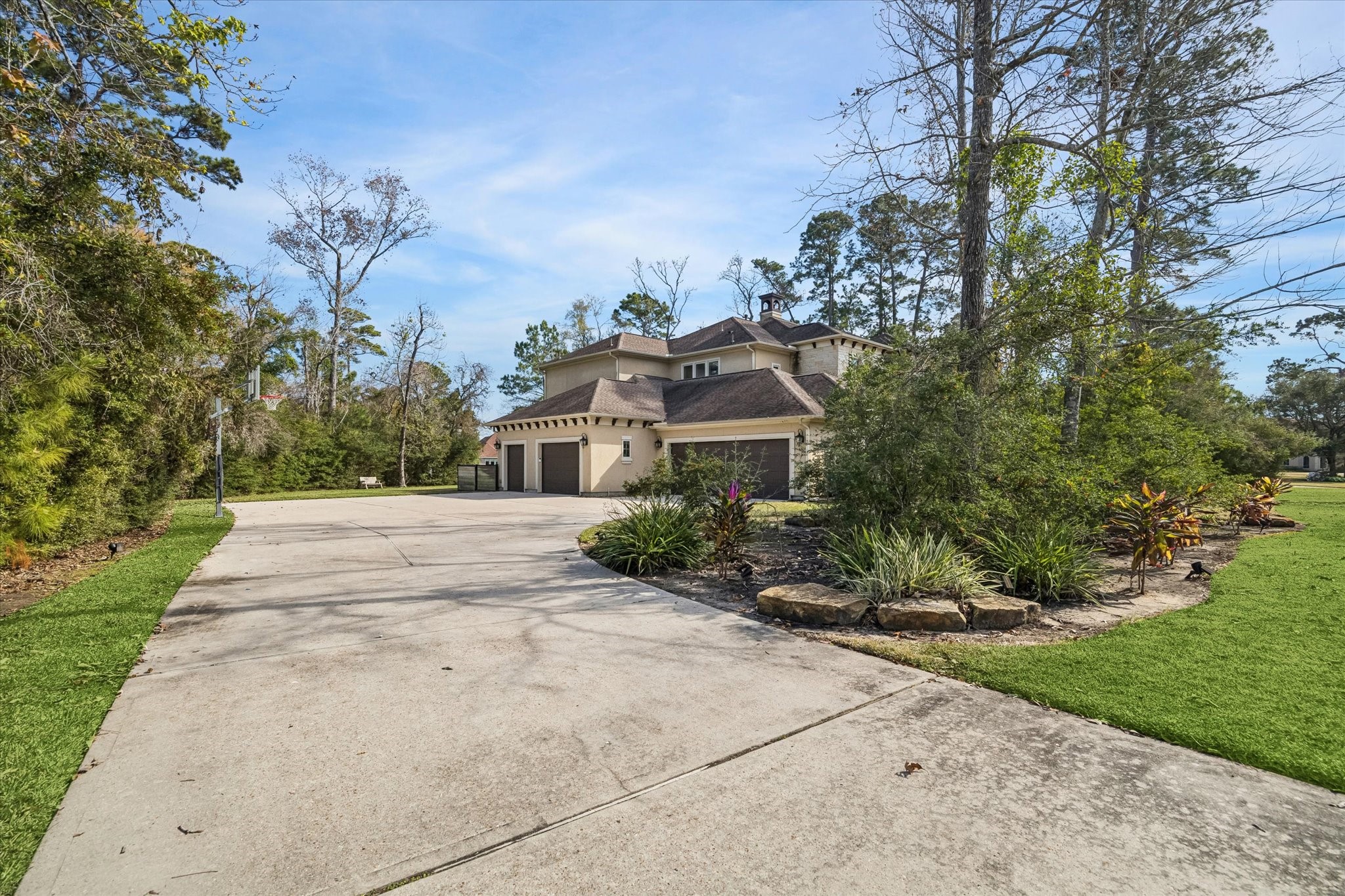 21018 Kings River Point Kingwood, TX 77346 - Photo 49 of 50 a front view of a house with a yard and potted plants