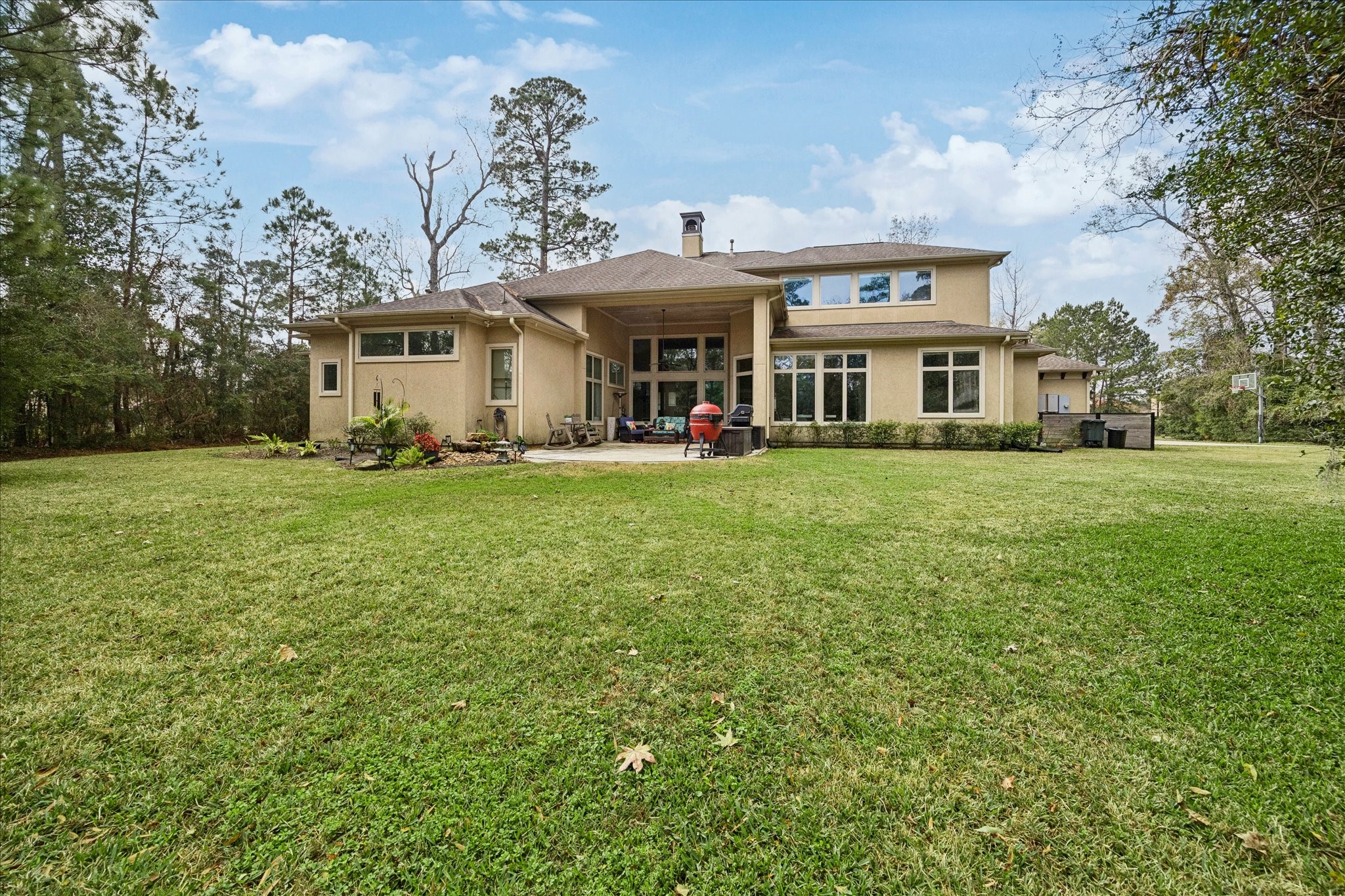21018 Kings River Point Kingwood, TX 77346 - Photo 5 of 50 a front view of a house with a yard