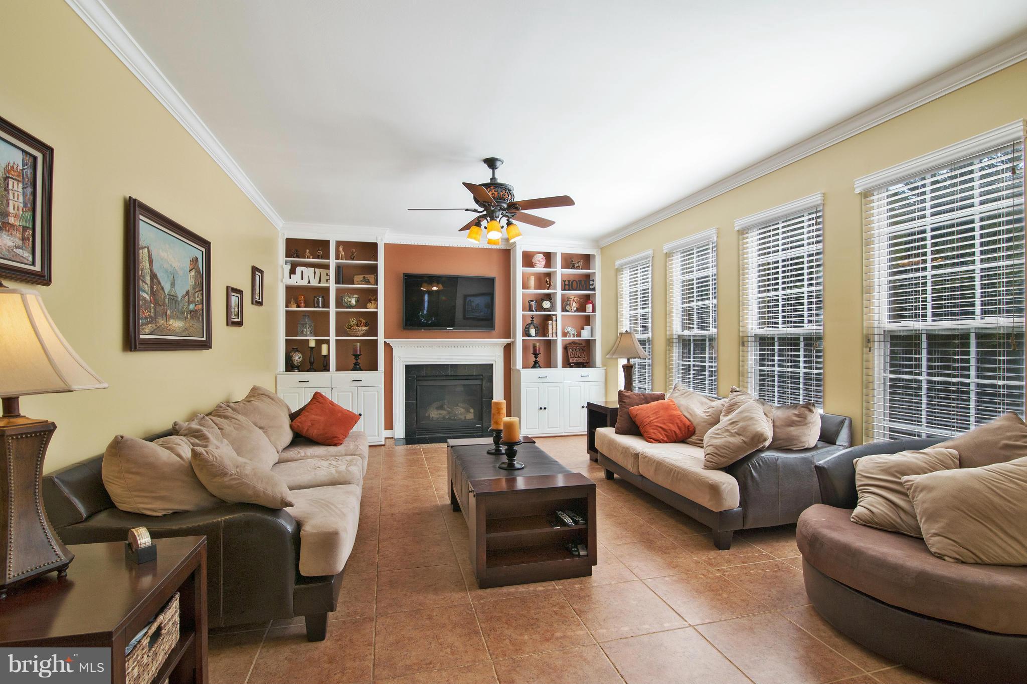 8327 Academy Road Ellicott City, MD 21043 - Photo 8 of 30 Family room w/gas fireplace and built-in bookcases