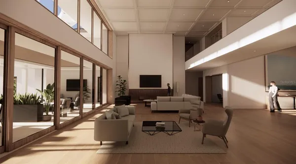 a living room with couches a barbecue dining table and chairs with outer view