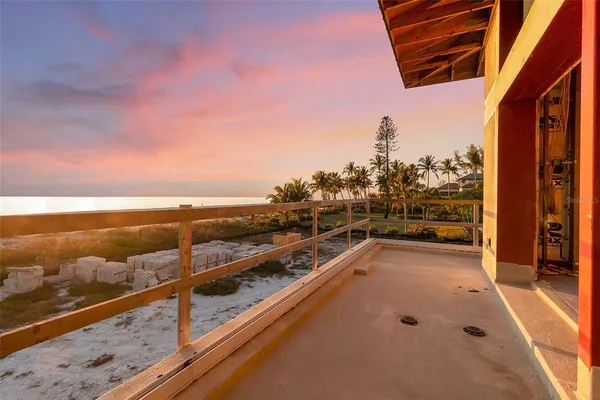 a view of a balcony with chairs