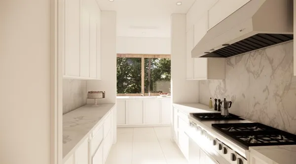 a large white kitchen with a large window