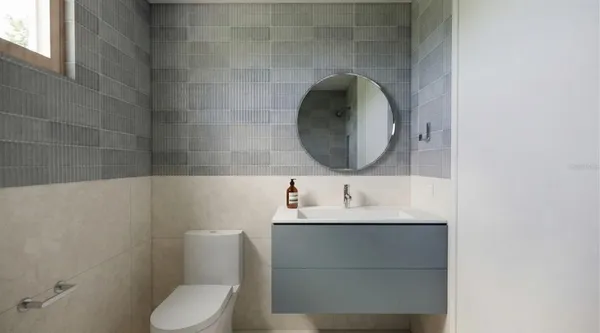 a bedroom with a bed and a tv