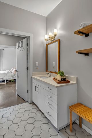 a room with a dresser and gym equipment