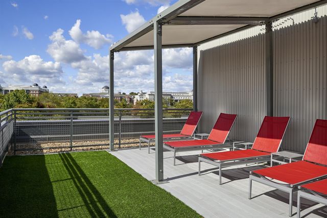 a kitchen with sink refrigerator and dining table