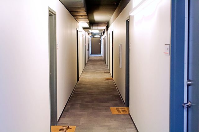 a street sign on a wall next to a building