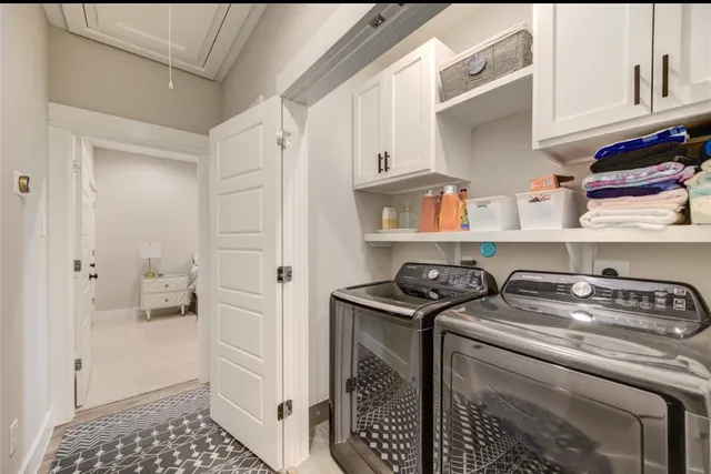 a utility room with closet dryer and washer