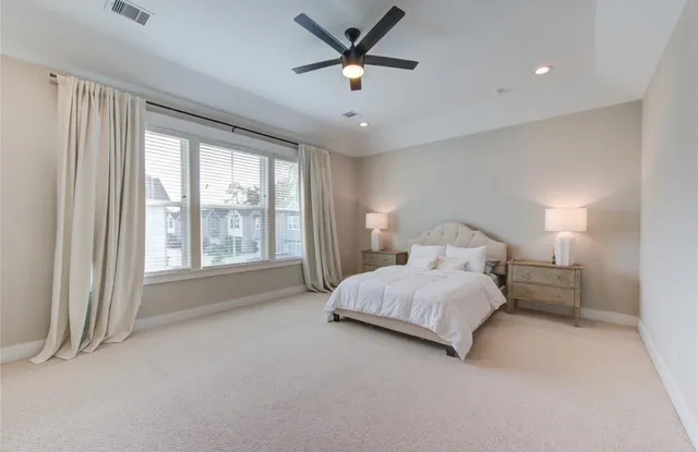 a bedroom with bed and window