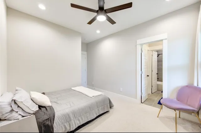 a bedroom with a bed and a chair