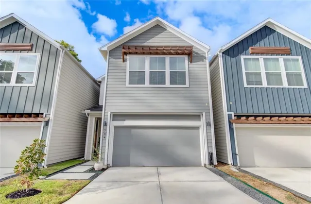 a front view of a house with a garage