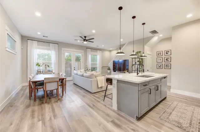 a kitchen with a stove and chairs