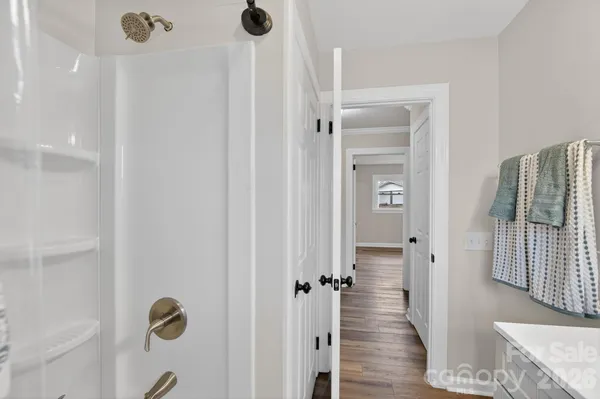 a view of a bathroom from a hallway