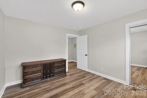 a view of room with wooden floor