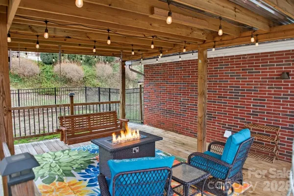 a view of a chairs and table in the patio