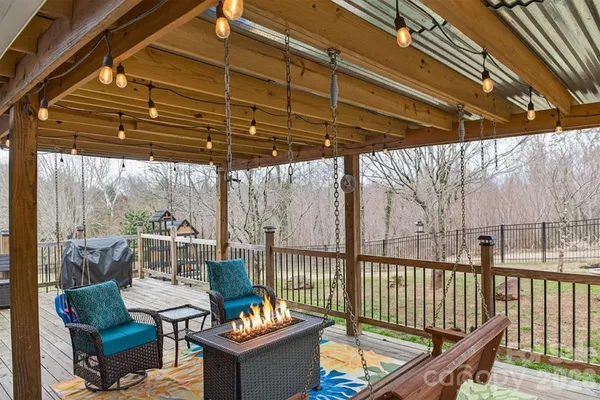 a view of a chairs and table in the balcony