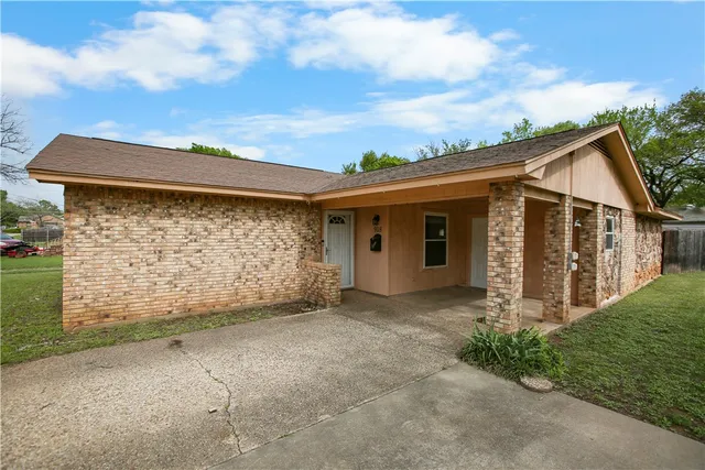 front view of a house with a street