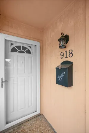 a view of a door and a utility room