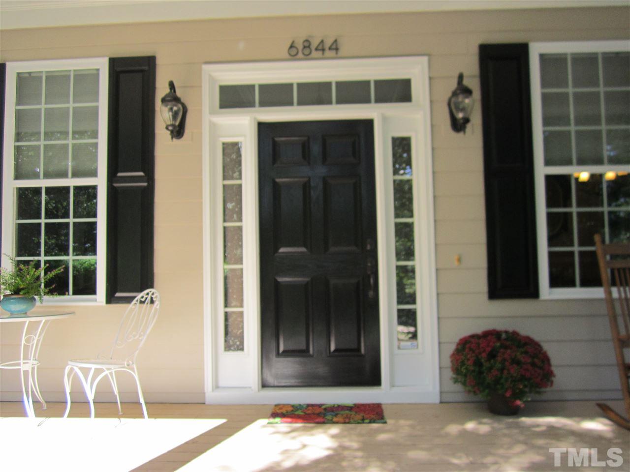 6844 Pond Road Wendell, NC 27591 - Photo 2 of 25 a front view of a house with a yard