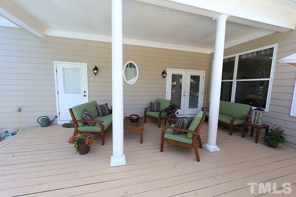 6844 Pond Road Wendell, NC 27591 - Photo 20 of 25 a view of living room filled with furniture and wooden floor