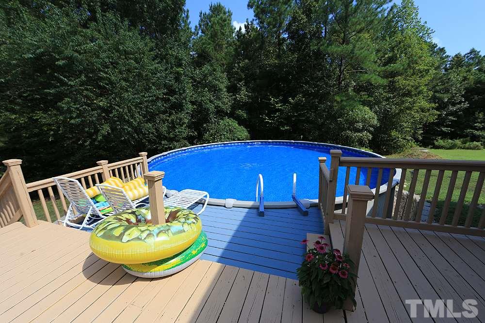 6844 Pond Road Wendell, NC 27591 - Photo 22 of 25 a view of a chairs and table on the wooden floor