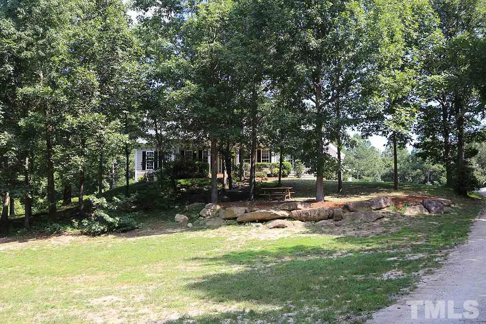 6844 Pond Road Wendell, NC 27591 - Photo 23 of 25 a backyard of a house with table and chairs