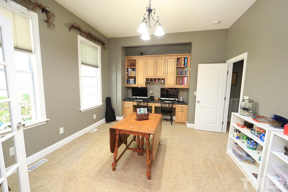 6844 Pond Road Wendell, NC 27591 - Photo 6 of 25 a room with furniture and a window