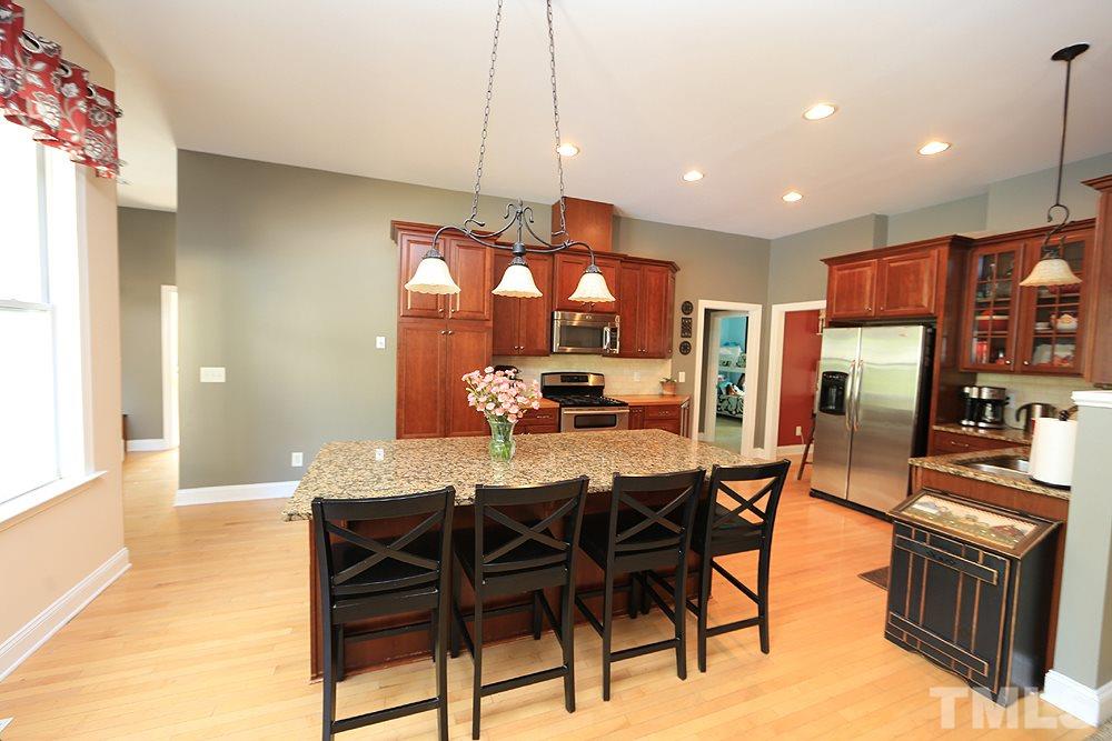 6844 Pond Road Wendell, NC 27591 - Photo 9 of 25 a view of a dining room with furniture