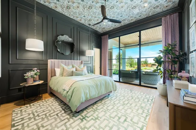 a bedroom with a large bed and a large window