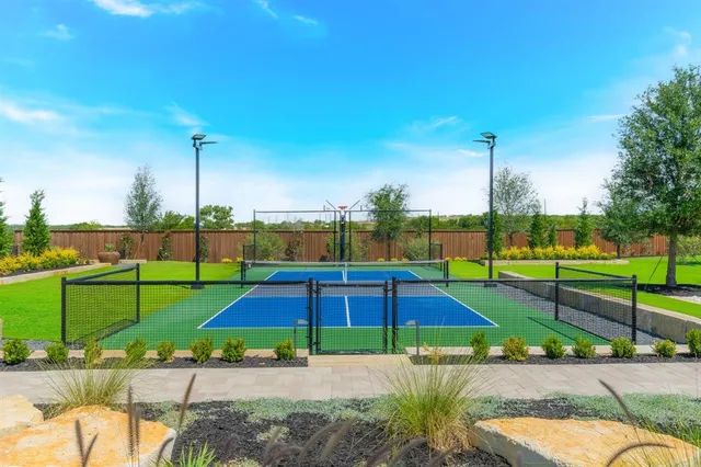 a swimming pool with outdoor seating and yard