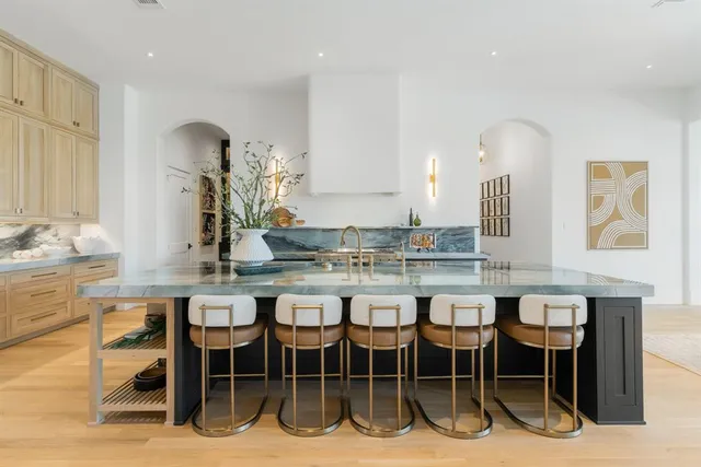 a dining hall with a table and chairs