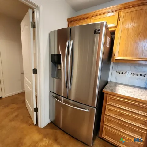 a stove top oven sitting inside of a kitchen