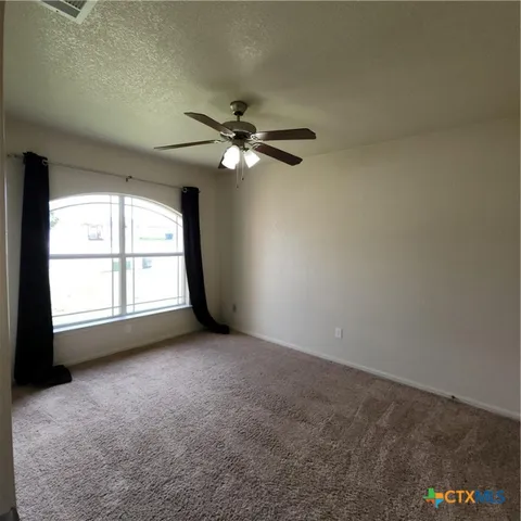 a bathroom with a granite countertop sink a toilet and shower