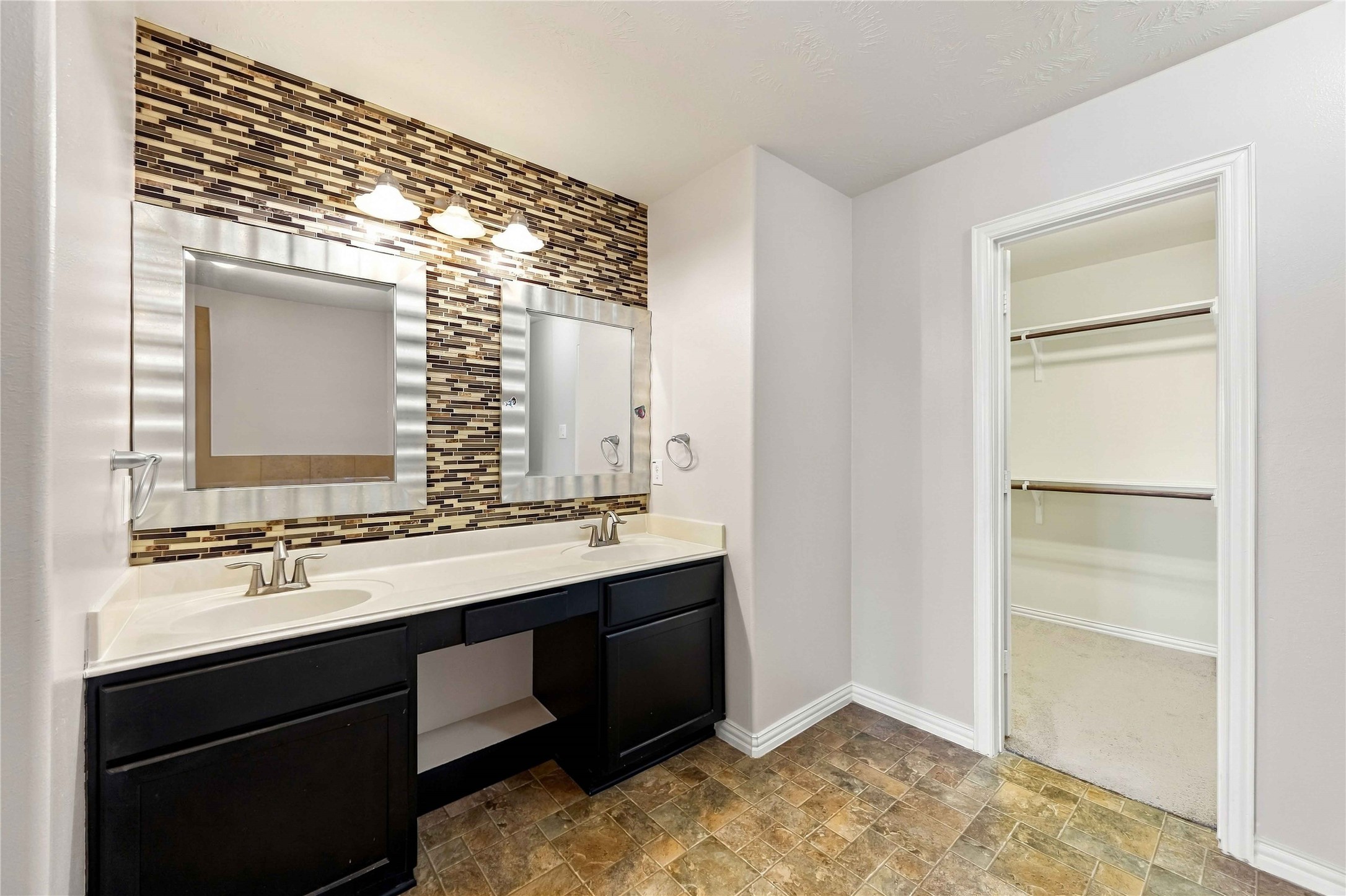 8338 Rudy Brook Way Spring, TX 77379 - Photo 20 of 33 The primary bath features dual sinks and generous vanity space to help make busy mornings easier.