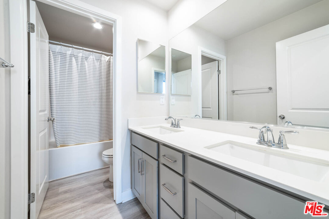 587 Daniel Freeman Circle Inglewood, CA 90301 - Photo 13 of 25 a bathroom with a sink a toilet and shower