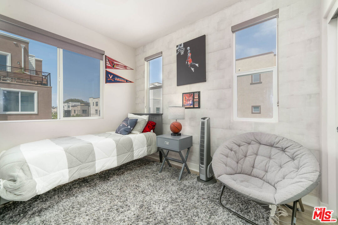 587 Daniel Freeman Circle Inglewood, CA 90301 - Photo 14 of 25 a bedroom with furniture and a couch