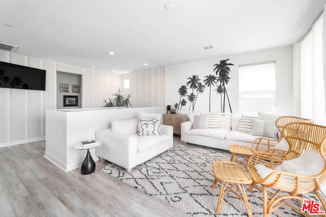 587 Daniel Freeman Circle Inglewood, CA 90301 - Photo 17 of 25 a living room with furniture and a wooden floor