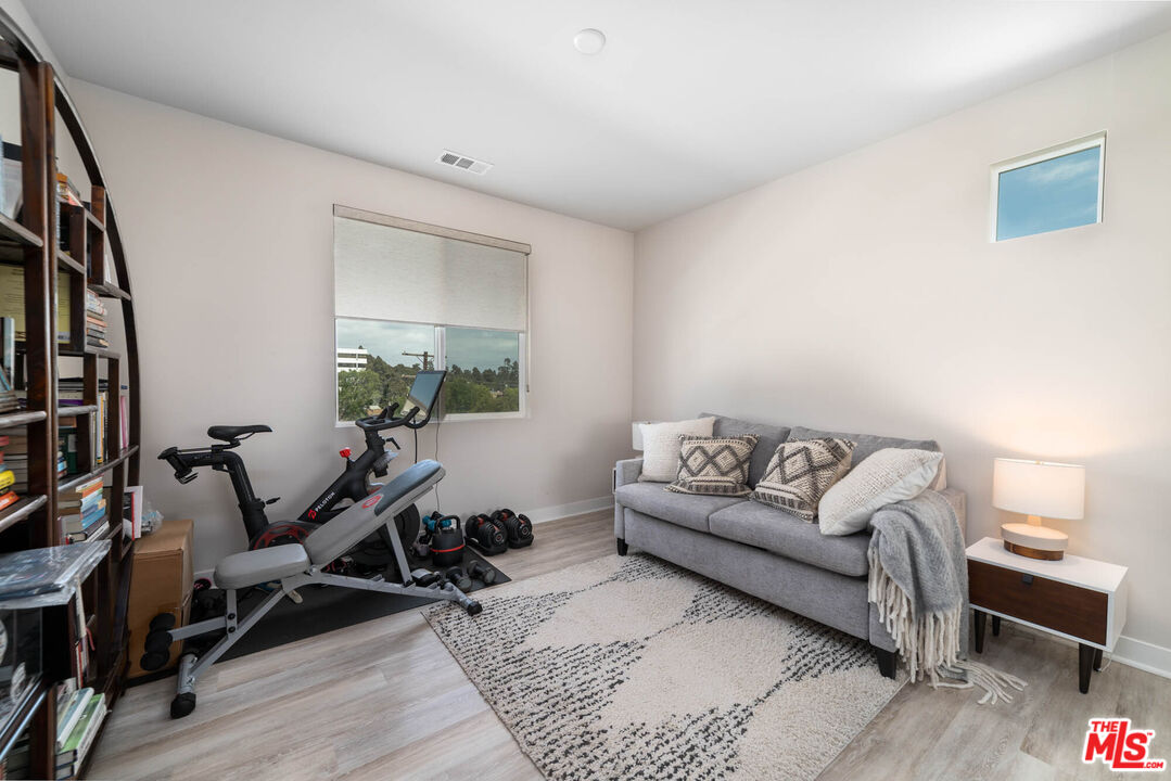 587 Daniel Freeman Circle Inglewood, CA 90301 - Photo 18 of 25 a living room with furniture a rug and a window