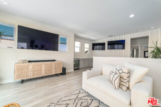 587 Daniel Freeman Circle Inglewood, CA 90301 - Photo 20 of 25 a living room with furniture and a flat screen tv