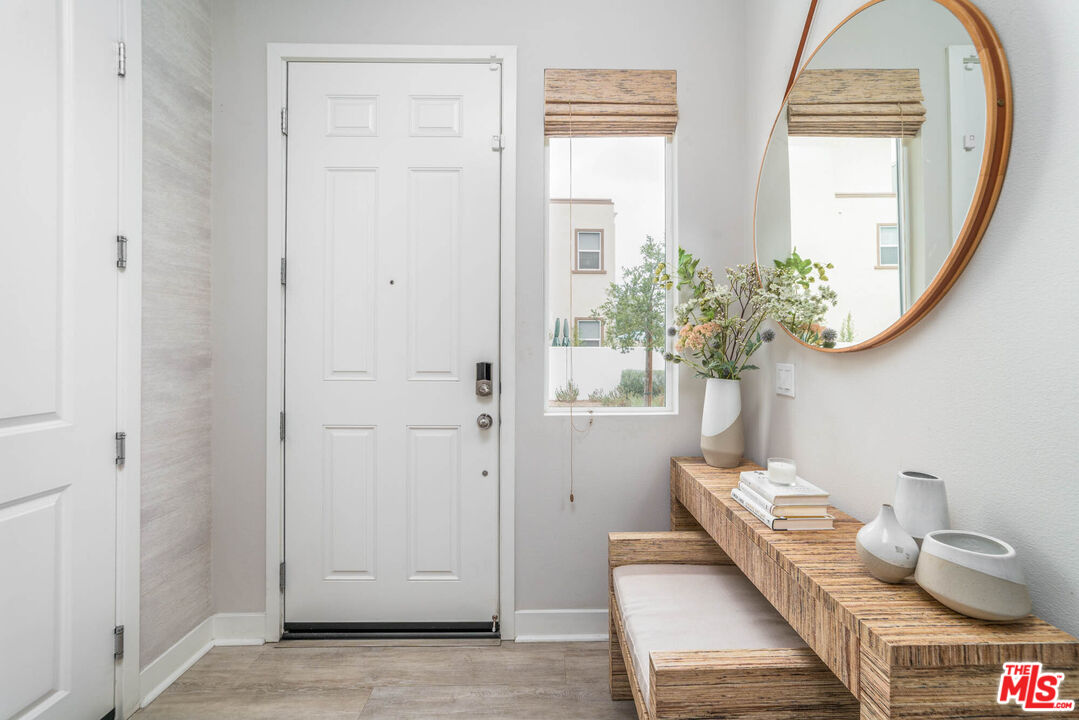 587 Daniel Freeman Circle Inglewood, CA 90301 - Photo 2 of 25 a living room with furniture and a potted plant