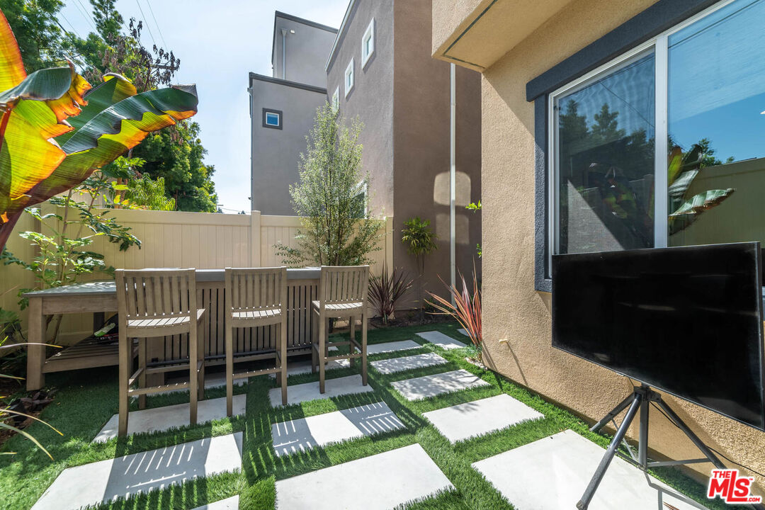 587 Daniel Freeman Circle Inglewood, CA 90301 - Photo 23 of 25 a view of a chairs and table in backyard of the house