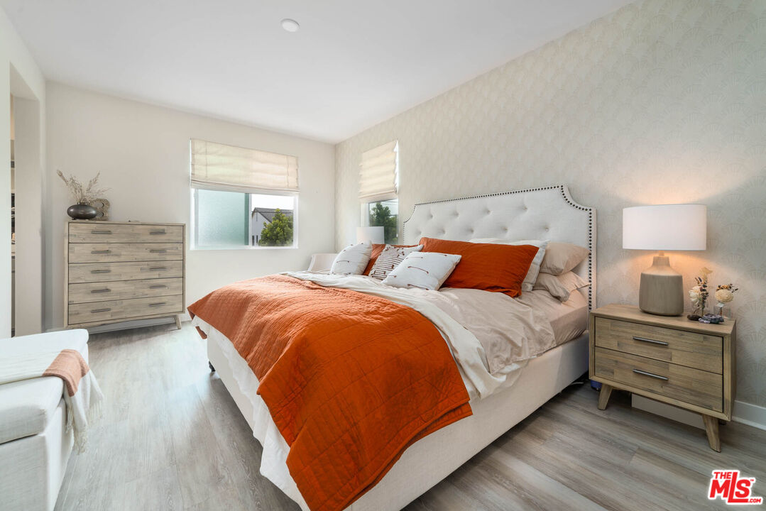 587 Daniel Freeman Circle Inglewood, CA 90301 - Photo 9 of 25 a bedroom with a bed and a dresser