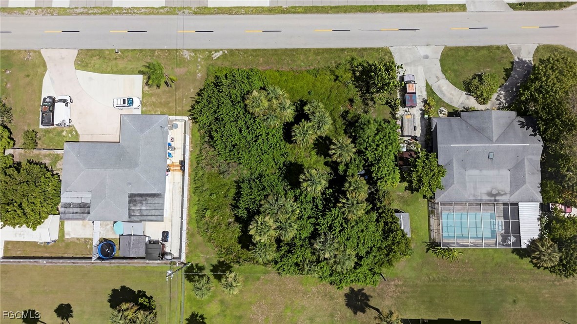 1904 East 6th Street Lehigh Acres, FL 33936 - Photo 7 of 11 an aerial view of a house with a yard swimming pool