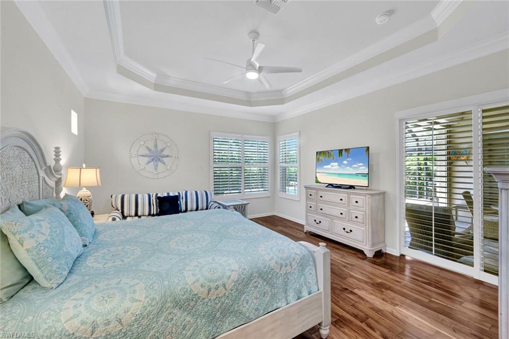16208 Parque Lane Naples, FL 34110 - Photo 13 of 22 a bedroom with a bed and a dresser