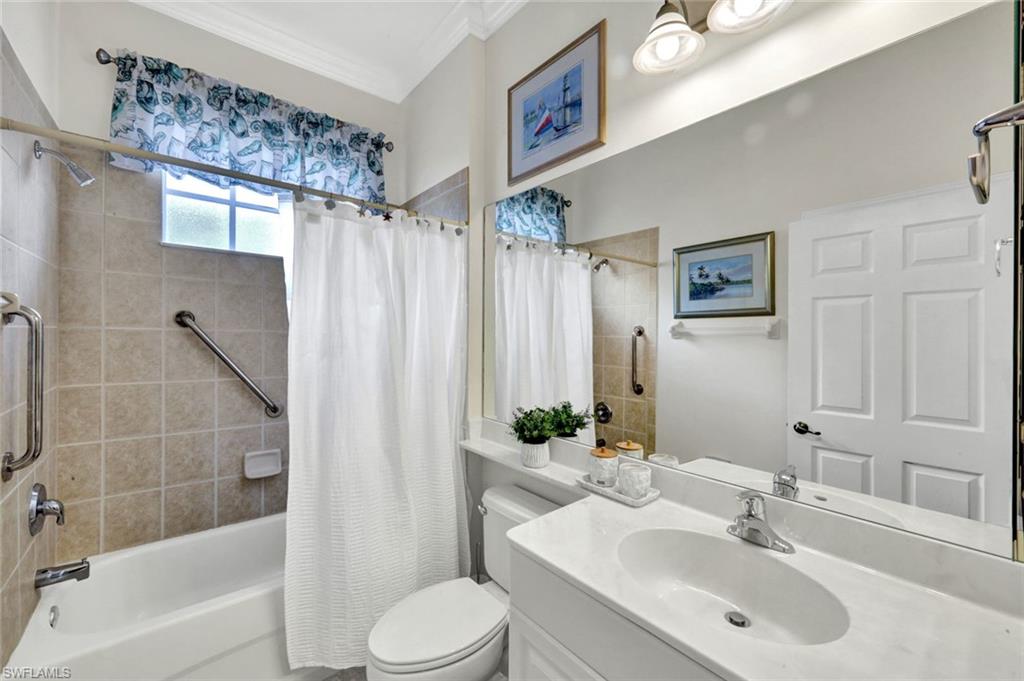 16208 Parque Lane Naples, FL 34110 - Photo 16 of 22 a bathroom with a sink toilet and shower