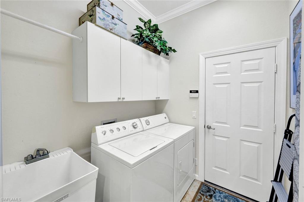 16208 Parque Lane Naples, FL 34110 - Photo 18 of 22 a utility room with dryer and washer